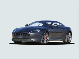 Dark metallic Aston Martin DB9 shown from the front three-quarter angle in a studio setting